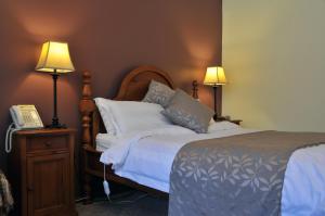 מיטה או מיטות בחדר ב-Black Spur Inn