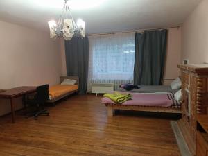 Postel nebo postele na pokoji v ubytování Krone Hostel