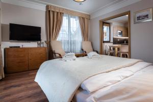 Postel nebo postele na pokoji v ubytování TATRYSTAY Apartment Javor Tatranská Lomnica