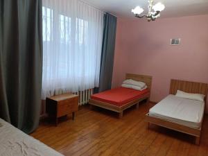 Postel nebo postele na pokoji v ubytování Krone Hostel