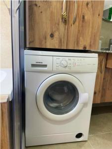 a white washer and dryer in a kitchen at Luxury Flat of Cleodora Residence in Serik