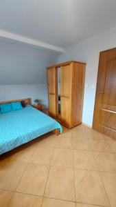 Posteľ alebo postele v izbe v ubytovaní Apartamenty Suzyw Pilsko