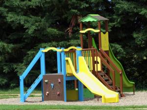 a playground with a slide in a park at Gîte Meillard, 3 pièces, 4 personnes - FR-1-489-267 in Meillard