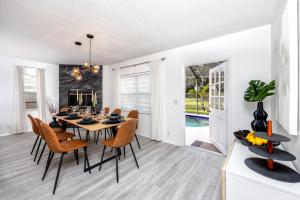 a dining room with a table and chairs at 13 Beach Cottage With Heated Pool In Clearwater in Clearwater