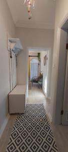 a hallway with a stairway with a rug on the floor at Denize Çok Yakın Daire in Side