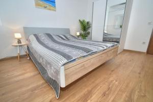 Postel nebo postele na pokoji v ubytování Apartments Bartulić