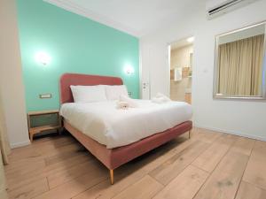 a bedroom with a large bed in a room at La Perle Hotel in Jerusalem