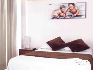 Postel nebo postele na pokoji v ubytování Zuruma Hotel