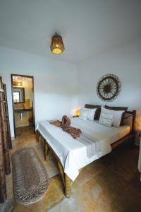 a bedroom with a bed in a room at 7 Beaufort - Kitesurf Pousada in Itarema