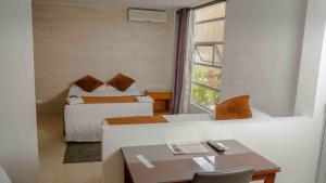 Cama o camas de una habitación en Zuruma Hotel