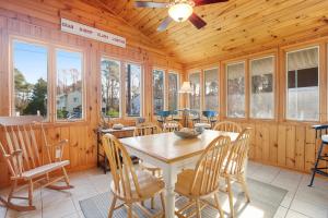 a dining room with a table and chairs at Town of Bethany Beach -- 33282 Argyle in Bethany Beach