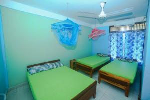 Katil atau katil-katil dalam bilik di Tony's Garden House Back Packers inn