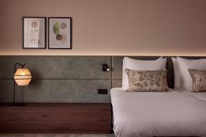 Postel nebo postele na pokoji v ubytování Van der Valk Hotel Lelystad