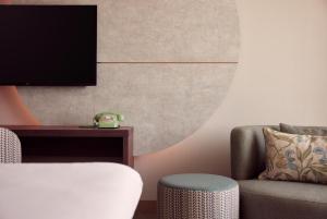 TV a/nebo společenská místnost v ubytování Van der Valk Hotel Lelystad