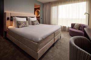 Postel nebo postele na pokoji v ubytování Van der Valk Hotel Lelystad