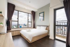 Кровать или кровати в номере Infinity Pool Signature - Saigon Rivergate
