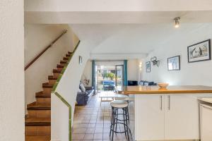 a kitchen and living room with a counter and stairs at Isla Cartago 49 Empuriabrava - Immo Barneda in Empuriabrava +44 photos