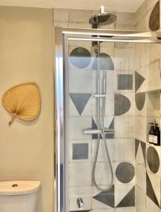 a bathroom with a shower and a toilet at Harbour View House in St Ives