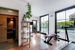 an open living room with treadmills and a gym at All Suites Le Teich – Bassin d’Arcachon in Le Teich