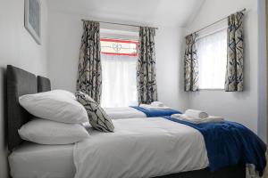 Postel nebo postele na pokoji v ubytování Meirion Cottage