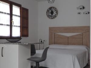 Postel nebo postele na pokoji v ubytování El APARTAMENTUCO