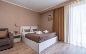 Postel nebo postele na pokoji v ubytování New Gudauri Loft 2 Apartments