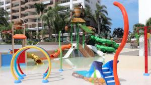 a water park with a bunch of playground equipment at Beachfront Resort Condo beside la Isla Mall in Puerto Vallarta