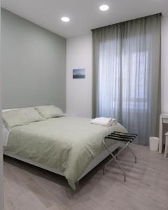 Cama ou camas em um quarto em Dimora Cavour