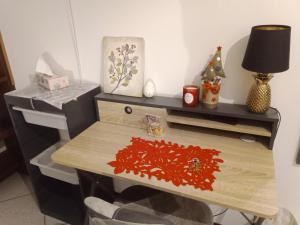 a desk with a table with a christmas decoration on it at A CASA DI GEMMA in Bologna