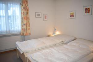 Postel nebo postele na pokoji v ubytování Lodola 298 2 Hk , Wohnung 2