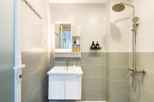 a bathroom with a sink and a shower at Ekomo Home 102 - Central Saigon in Ho Chi Minh City +56 photos