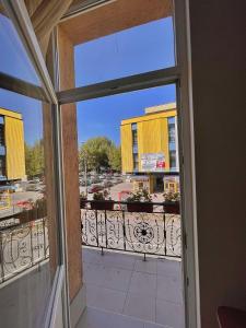 a view from an open door of a balcony at Rooms Sonata in Kyustendil