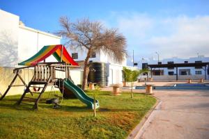 a playground with a kite and a slide at 3 HABITACIONES, CERCA DE LA PLAYA, Cantera Residencial in San Carlos