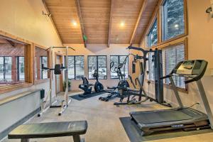 a gym with treadmills and ellipticals in a room with windows at Pinetop Townhome with Private Patio and Gas Grill in Pinetop-Lakeside