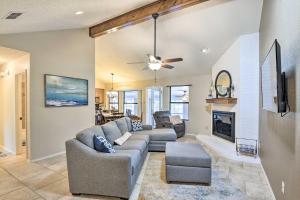 a living room with a couch and a fireplace at Granbury Home with Lake Granbury Access and Dock! in Granbury