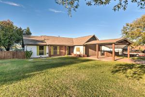 a home with a large yard with a house at Granbury Home with Lake Granbury Access and Dock! in Granbury