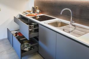 a kitchen with a sink and a counter top at Villa Santa Maria in Lovero Valtellino +58 photos