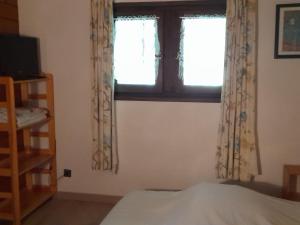 Postel nebo postele na pokoji v ubytování Appartement duplex à Châtel - 3 pièces, 6 personnes, parking couvert, proche télésiège et navettes - FR-1-198-104