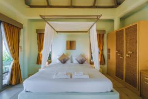 Postel nebo postele na pokoji v ubytování Punnpreeda Beach Resort - SHA Plus Certified