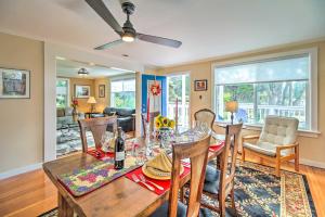 a dining room and living room with a table and chairs at Fort Bragg Home, Close to Laguna Point Beach! in Fort Bragg