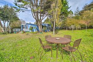 a table and chairs in a yard with a house at Fort Bragg Home, Close to Laguna Point Beach! in Fort Bragg