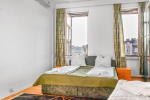 Postel nebo postele na pokoji v ubytování Joyful 2BR Shared Apt Near Millenium Tower & Danube River