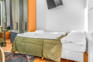 Postel nebo postele na pokoji v ubytování Joyful 2BR Shared Apt Near Millenium Tower & Danube River