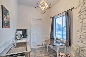 a dining room with a table and a window at Stylish Klamath Falls Unit Less Than half Mi to OIT! in Klamath Falls