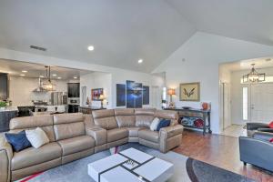 a living room with a couch and a kitchen at Alluring Home with Fire Pit Less Than half Mi to OIT! in Klamath Falls