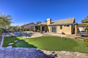 a home with a putting green and a pool at Airy Scottsdale Oasis with Pool and Putting Green in Scottsdale