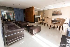 a dining room with chairs and tables and a dining room at Uriburu 1756 by Ayres Apartments Recoleta in Buenos Aires