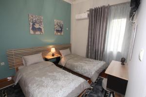 Posteľ alebo postele v izbe v ubytovaní Bratis House Athens