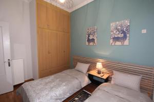 Posteľ alebo postele v izbe v ubytovaní Bratis House Athens