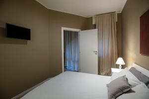 A bed or beds in a room at Appartamento Kosta